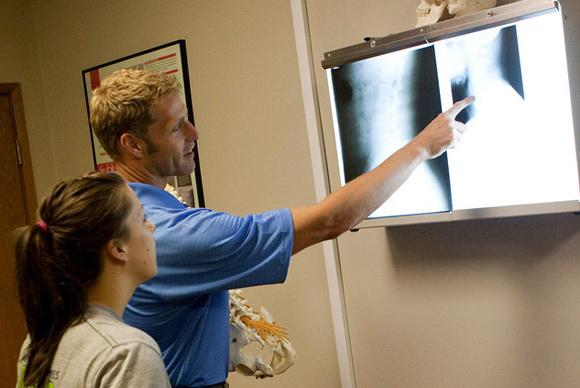 dr phillip spencer examining patient xray